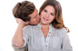 young man kissing his girlfriend