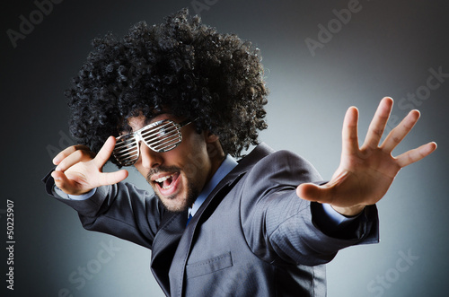 Photo: Man with afro haircut singing in studio Man with afro haircut singing in studio