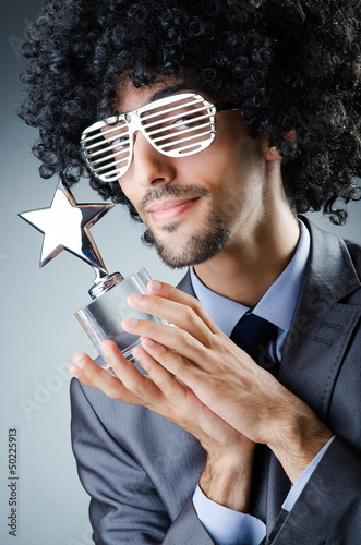 Photo: Singer receiving star prize award Singer receiving star prize award
