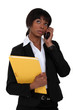 Afro-American businesswoman talking on her cell