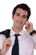Confident businessman stood with jacket over his shoulder