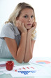 young businesswoman examining the statistics