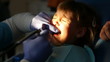 dentist treats teeth child