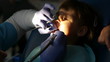 dentist treats teeth child
