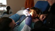 dentist treats teeth child