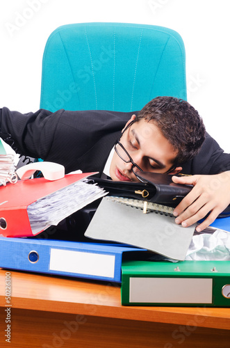 Photo: Young busy businessman at his desk Young busy businessman at his desk
