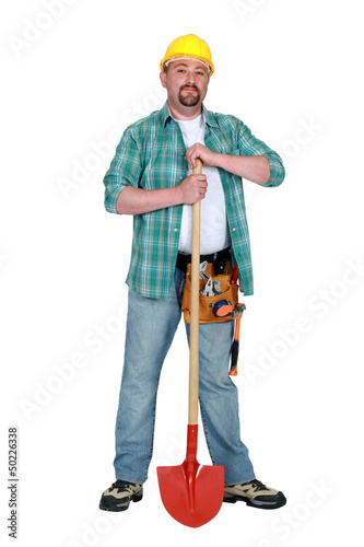 Photo: Mason stood with shovel Mason stood with shovel