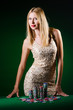 Woman in casino playing cards