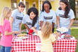 Photo: Women And Children Running Charity Bake Sale Women And Children Running Charity Bake Sale
