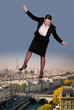 Businesswoman balancing on tight rope