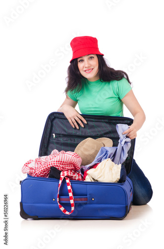 Photo: Young girl packing for vacation Young girl packing for vacation