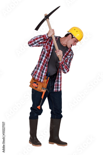 Photo: Man with pickaxe Man with pickaxe