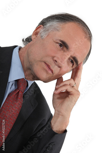 Photo: Businessman thinking alone Businessman thinking alone