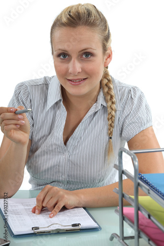 Photo: young blonde secretary writing young blonde secretary writing
