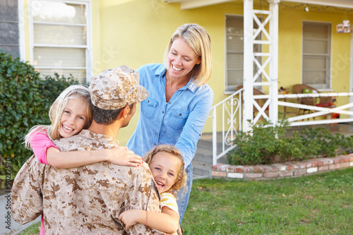 Photo: Family Welcoming Husband Home On Army Leave Family Welcoming Husband Home On Army Leave