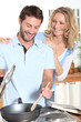 Smiling couple cooking