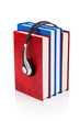 Concept of audio books with earphones on white