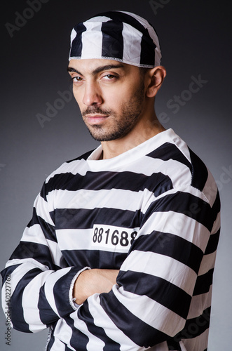 Photo: Convict criminal in striped uniform Convict criminal in striped uniform