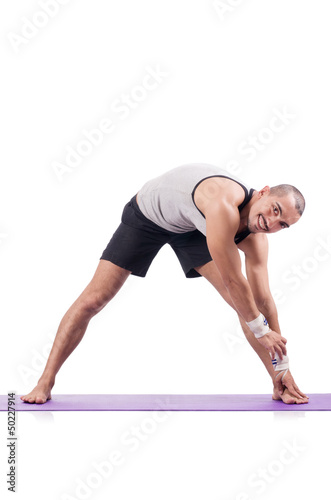 Photo: Man doing exercises on white Man doing exercises on white