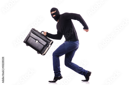 Photo: Industrial espionage concept with person in balaclava Industrial espionage concept with person in balaclava