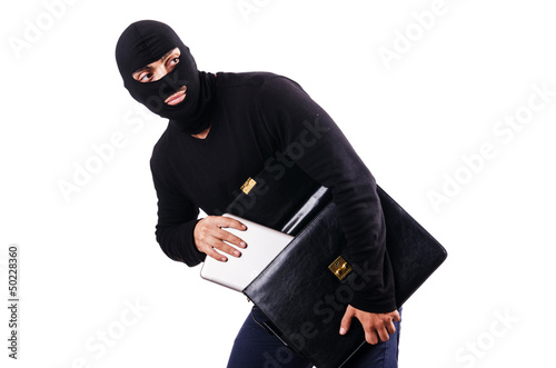 Photo: Industrial espionage concept with person in balaclava Industrial espionage concept with person in balaclava