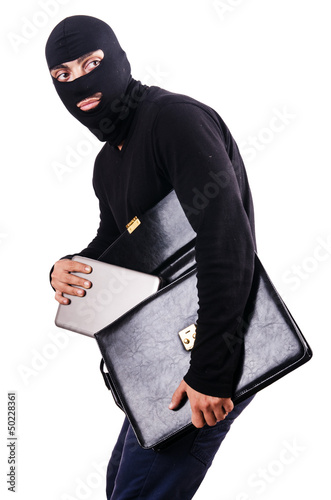 Photo: Industrial espionage concept with person in balaclava Industrial espionage concept with person in balaclava