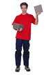 Tradesman holding a stack of tiles