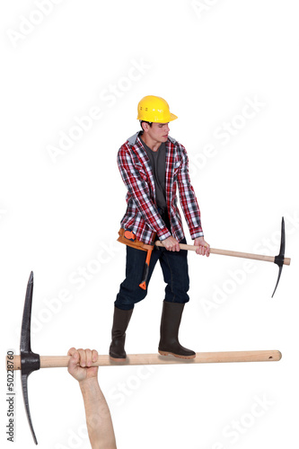 Photo: Worker with a pickaxe Worker with a pickaxe