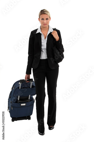 Photo: Woman going on a business trip Woman going on a business trip