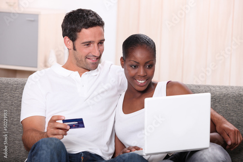 Photo: Couple shopping on the internet Couple shopping on the internet