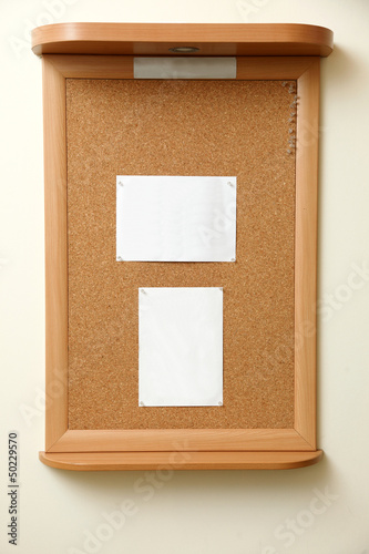 Photo: note paper pined on cork board background note paper pined on cork board background