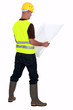 Foreman looking at blank plans
