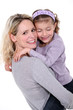 Woman hugging little girl