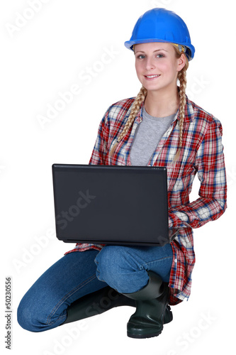 Photo: Construction worker with a laptop Construction worker with a laptop