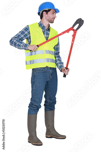 Photo: Man holding bolt cutters Man holding bolt cutters