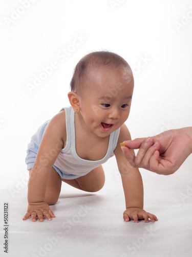 Photo: entice baby with biscuit entice baby with biscuit