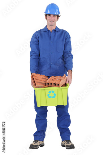 Photo: Workers with bricks for recycling Workers with bricks for recycling