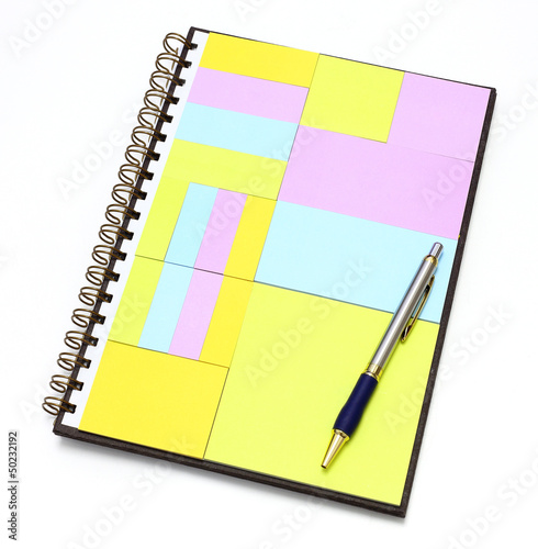 Photo: notepad in note book with pen notepad in note book with pen