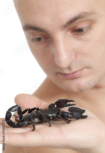 Photo: Man with scorpion on his palm Man with scorpion on his palm