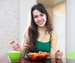 Woman eats veggie salad
