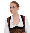 Photo: Skeptische Frau im Dirndl - böser Blick Skeptische Frau im Dirndl - böser Blick