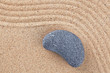 Curved pebble on raked sand