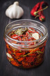 Dried cherry tomatoes with herbs and spices. Italian cuisine.