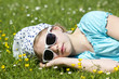 little girl lying on grass