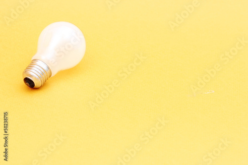 Photo: Background with lit lightbulb Background with lit lightbulb