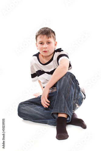 Photo: boy sitting on the floor boy sitting on the floor
