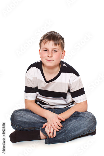 Photo: boy sitting on the floor boy sitting on the floor