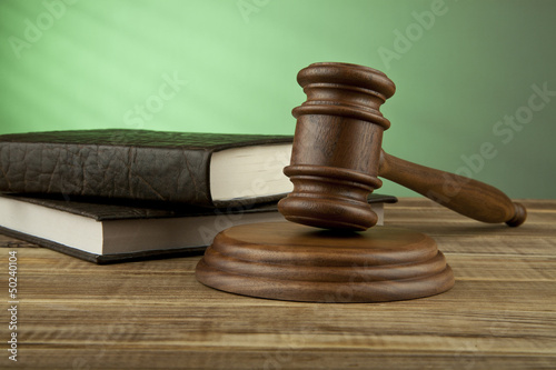 Photo: wooden mallet and books wooden mallet and books