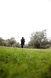 Photo: Teenage girl enjoying the view of a green field Teenage girl enjoying the view of a green field