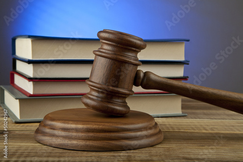 Photo: wooden mallet and books wooden mallet and books